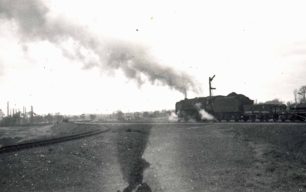 Steam engine and goods train on the Oxford line at Three Bridges