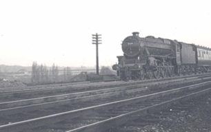 Passenger train nearing Bletchley at the Three Bridges