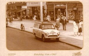 Bletchley Road (Queensway) with a van and shops