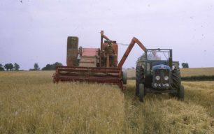 A combine harvester and a tractor