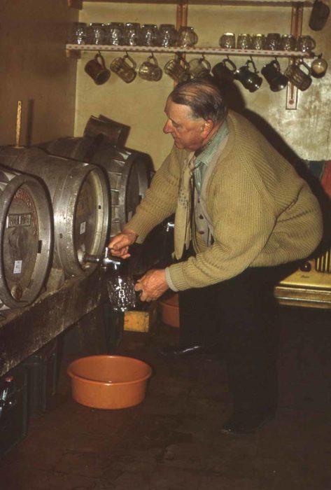 Landlord pouring a pint of beer
