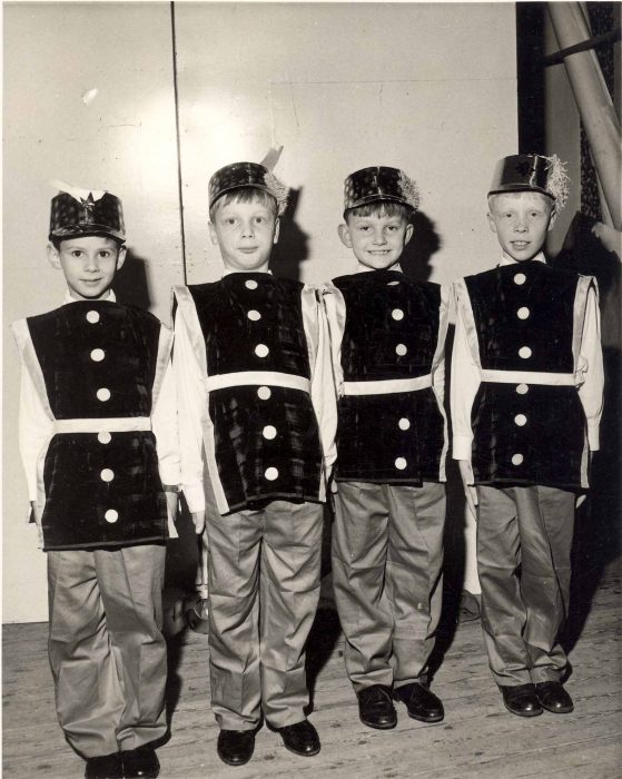 Four boys in soldier costumes