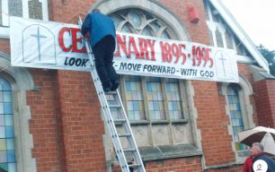 Centenary banner - being fixed up outside
