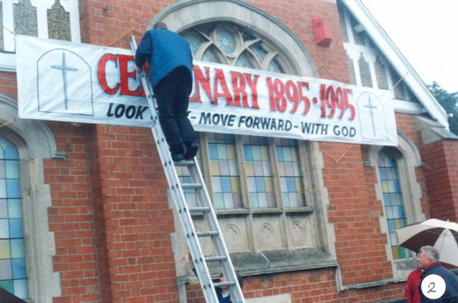 Centenary banner - being fixed up outside