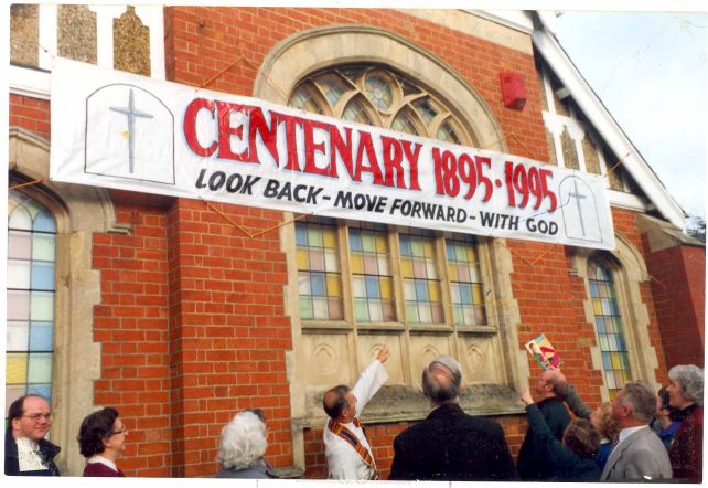 Centenary - church members admire banner