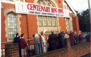 Centenary - church members admire banner