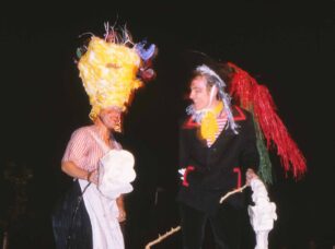 Two performers laughing together