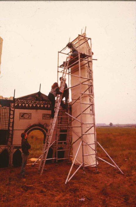 Stagehands erecting the castle