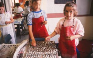 Two girls painting tesserae