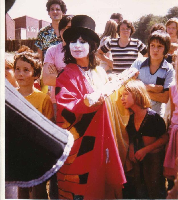 Carolyn Gorney in costume with top hat and face paint