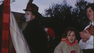 Performers with face paint and costumes