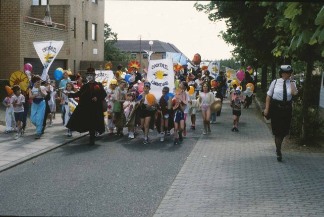 Tracy Walters leads the parade along a street