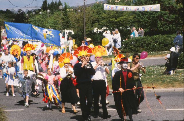 Tracy Walters leads the parade across a road