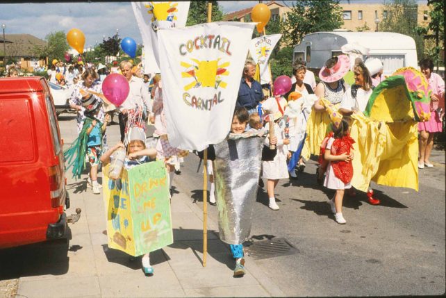 Parade of children and adults in costumes
