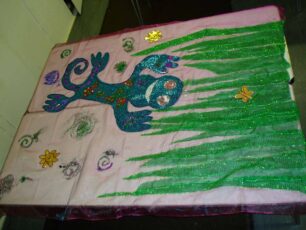 A blue Groovy Gecko banner