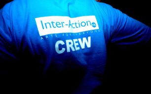 Inter-Action MK logo and 'CREW' on a T shirt