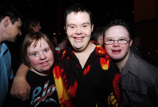 Three party-goers pose for the camera