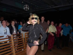 A Madonna impersonator dancing and singing