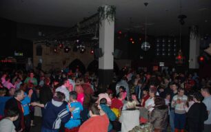 A view over the busy dance floor from the stairs