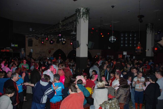 A view over the busy dance floor from the stairs