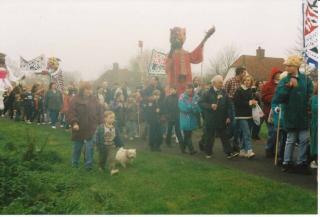 People parading with Gigantes and banners