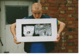 Man with his window box artwork
