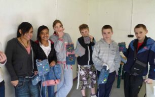 Six young people with their denim products