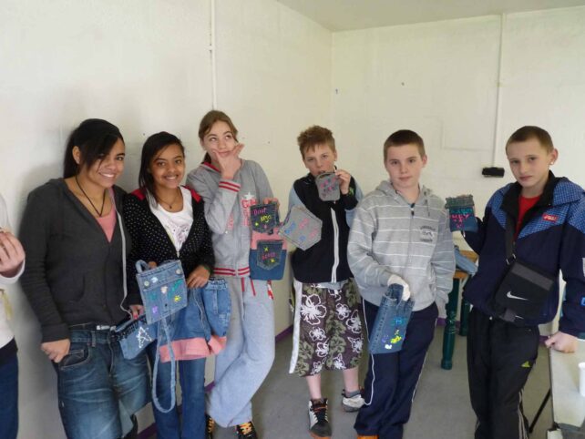 Six young people with their denim products
