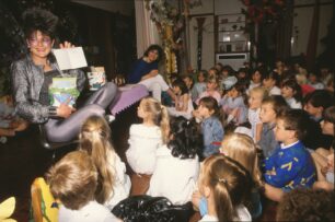 Zerena opens cards and presents from the children at the goodbye party