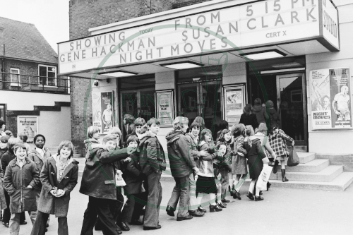 Children entering Studio Cinema, Bletchley to Watch 'All Creatures Great & Small' 1975