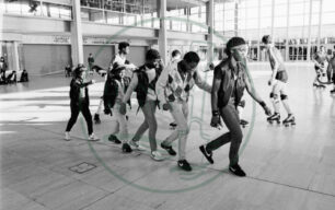 Musical Youth band-members striding across Middleton Hall - 1980s