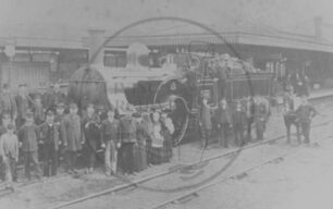 Steam locomotive 'Waverley' at Bletchley Railway Station with station staff -  c1904