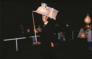 Man with small locomotive lantern on his head