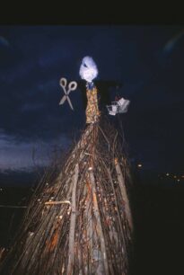 An effigy atop the unlit bonfire