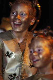 Two female elves in golden costumes