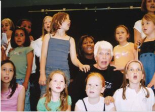 Children singing with theatre practitioners