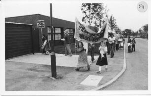 A procession with banners and musical instruments
