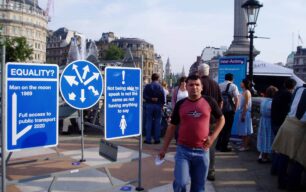 Three blue signs on display in Trafalgar Square