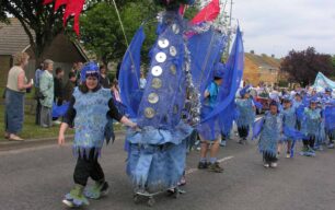 Large blue dragon parading (Wellsmead School)