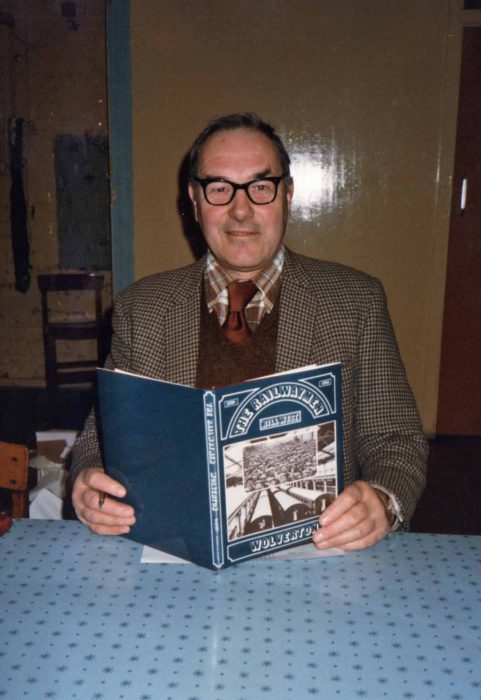 Bill West holding a copy of The Railwaymen - Wolverton