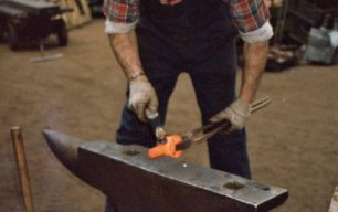 Blacksmith John Plottam working on a traditional anvil