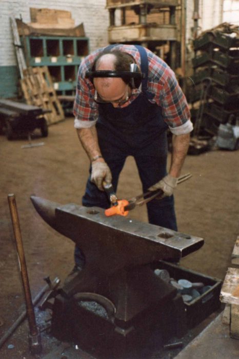 Blacksmith John Plottam working on a traditional anvil
