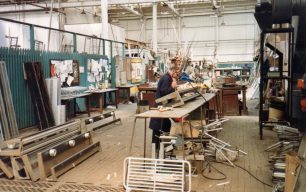 Alan Wright repairing luggage racks in Brass Shop