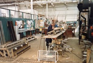 Alan Wright repairing luggage racks in Brass Shop