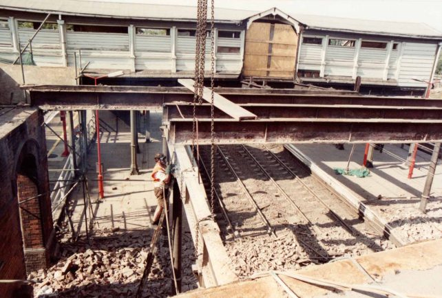 Contractors using cutting equipment to slice through the station main beams