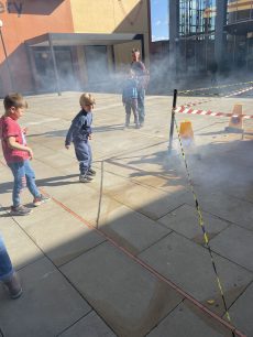 Children caught up in smoke from spacecraft