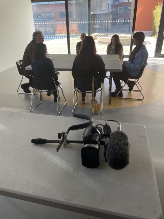 Young people learn how to film and record vox pop interviews at the Exhibition Opening