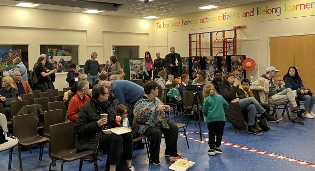 Audience gathers for screening of Educating Zerena in Willows School Hall, April 21st, 2023