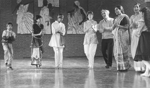 Asian folk dancers and guests