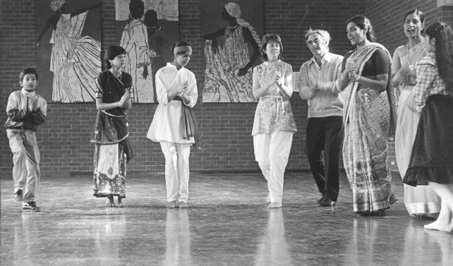 Asian folk dancers and guests